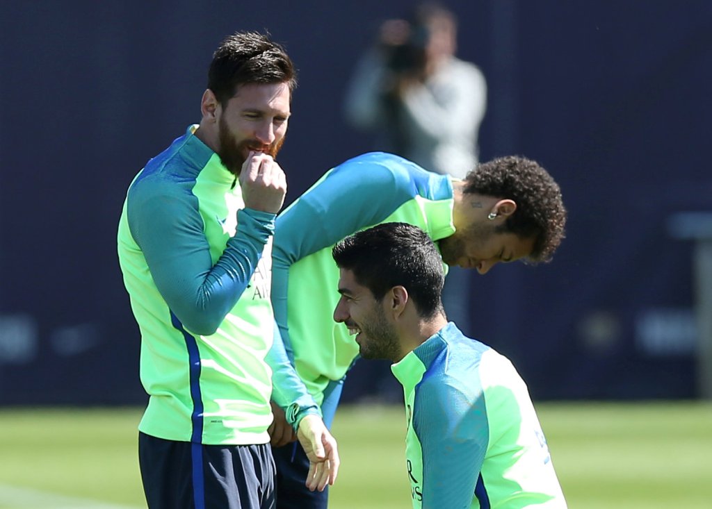 Barcelona's Lionel Messi, Neymar and Luis Suarez take part in a training session. REUTERS/Albert Gea
