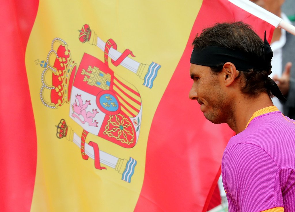 Rafael Nadal of Spain stands near a Spanish flag before his final against his compatriot Albert Ramos-Vinolas at the Monte Carlo Masters. REUTERS/Eric Gaillard
