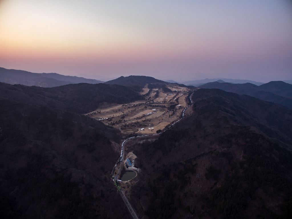 (FILES) This file photo taken on March 18, 2017 shows an aerial view of a golf course used as the site of a recently installed anti Terminal High Altitude Area Defense (THAAD) system in Seongju. Trailers carrying US THAAD missile defence equipment entered