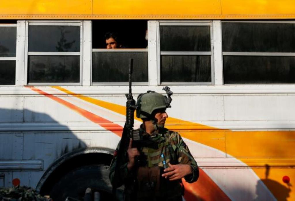 An Afghan security force member stands guard outside a military hospital at the site of blast and gunfire in Kabul, Afghanistan March 8, 2017. Reuters/Mohammad Ismail 