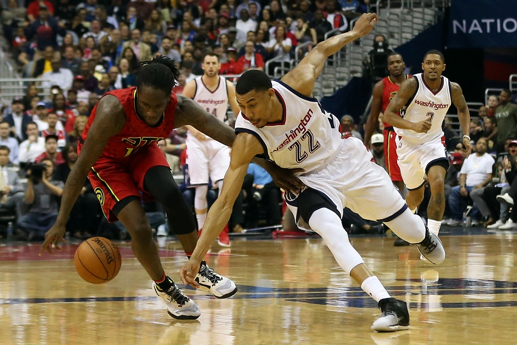 Atlanta Hawks forward Taurean Prince (12) and Washington Wizards forward Otto Porter Jr. (22) battle fora loose ball in the third quarter in game five of the first round of the 2017 NBA Playoffs at Verizon Center. Mandatory Credit: Geoff Burke-USA TODAY S