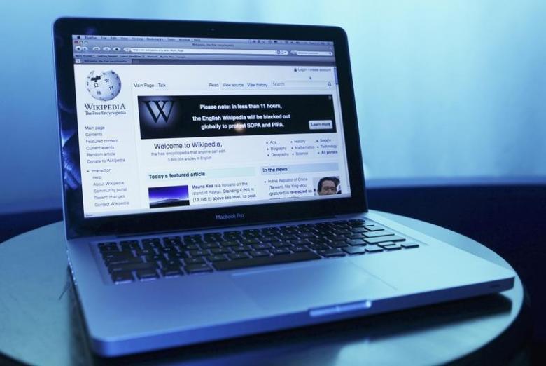 Wikipedia webpage in use on a laptop computer is seen in this photo illustration taken in Washington, January 17, 2012. REUTERS/Gary Cameron