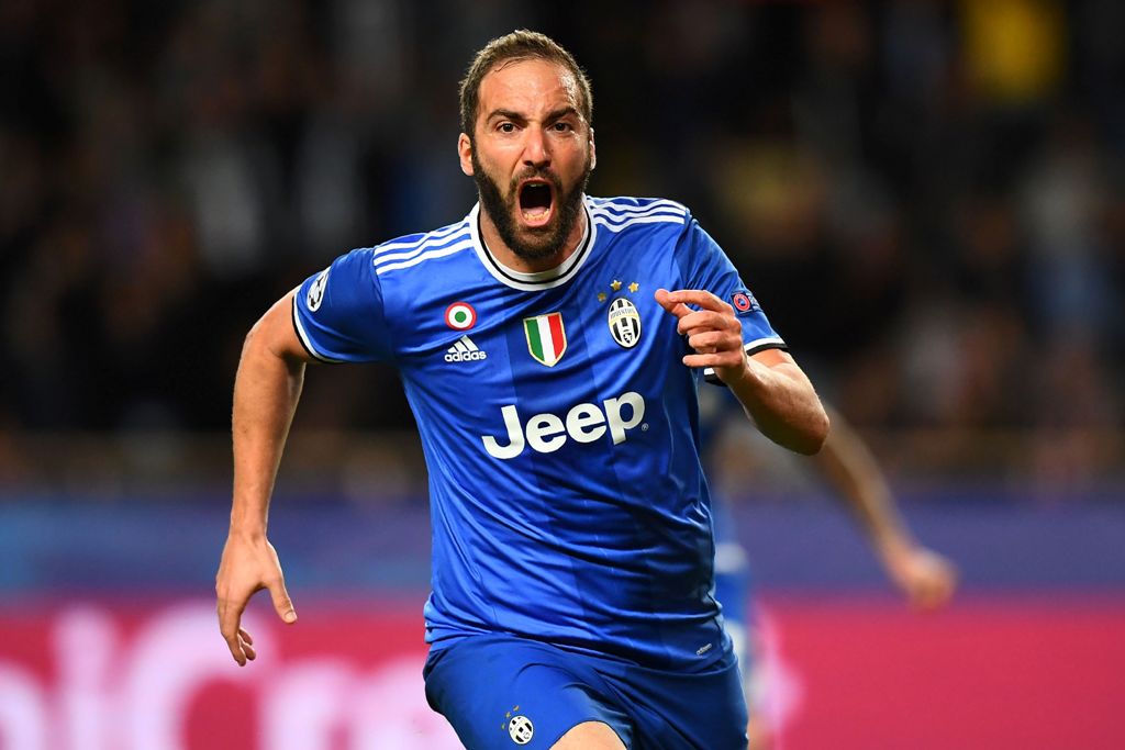 Juventus' forward from Argentina Gonzalo Higuain reacts after scoring a goal during the UEFA Champions League semi-final first leg football match Monaco vs Juventus at the Stade Louis II stadium in Monaco on May 3, 2017. / AFP / FRANCK FIFE
