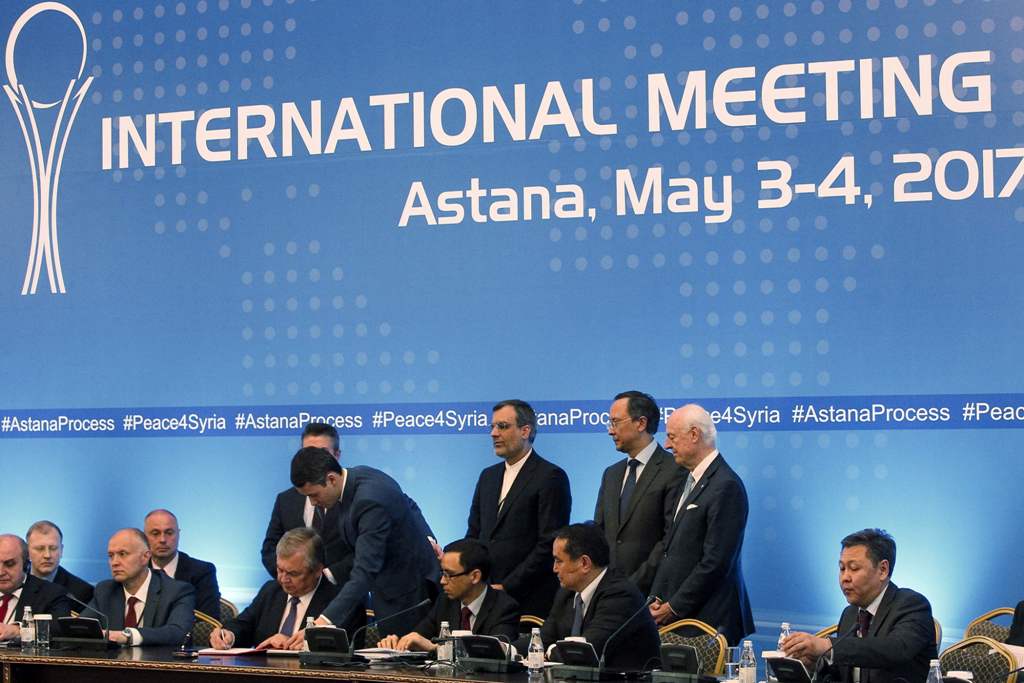Russian mediator Alexander Lavrentiev, Iranian deputy foreign minister Hossein Jaberi Ansari, Kazakh Foreign Minister Kairat Abdrakhmanov and UN Special Envoy for Syria Staffan de Mistura attend the signing of a memorandum on creating safe zones in Syria 