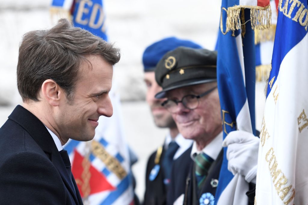 French president-elect Emmanuel Macron salutes the veterans during the ceremony marking the 72nd anniversary of the victory over Nazi Germany during WWII on May 8, 1945 under the Arc de Triomphe monument in Paris on May 8, 2017. / AFP / POOL / STEPHANE DE