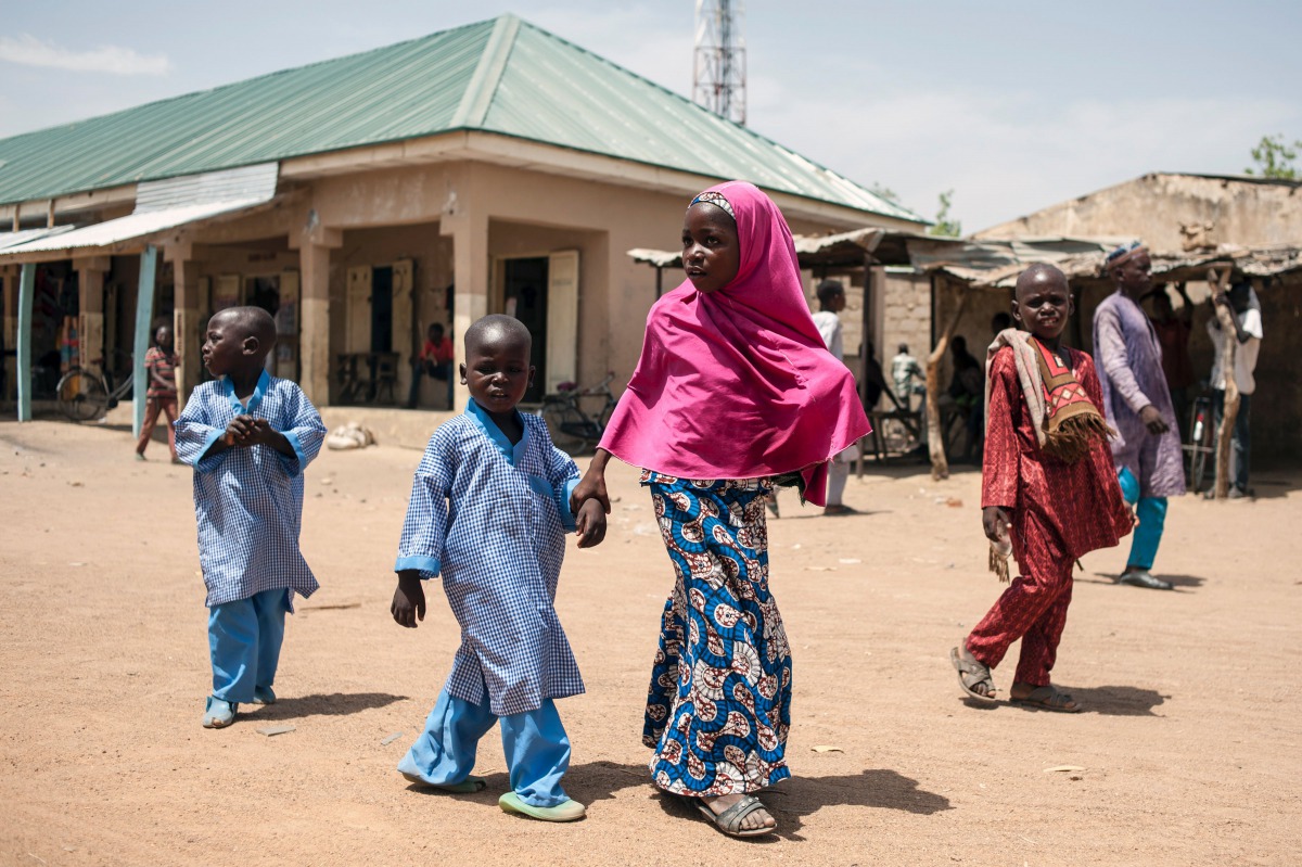 FILE PHOTO: Children walk down the street of Chibok in Borno State, northeast Nigeria on March 25, 2016 (AFP STEFAN HEUNIS) 