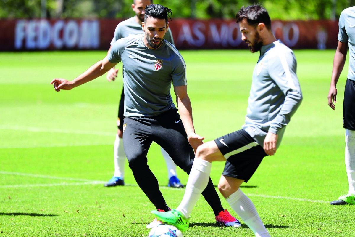 Monaco's Colombian forward Radamel Falcao (left) attends a training session yesterday in La Turbie, near Monaco, on the eve of the UEFA Champions League semi-final second leg against Juventus.