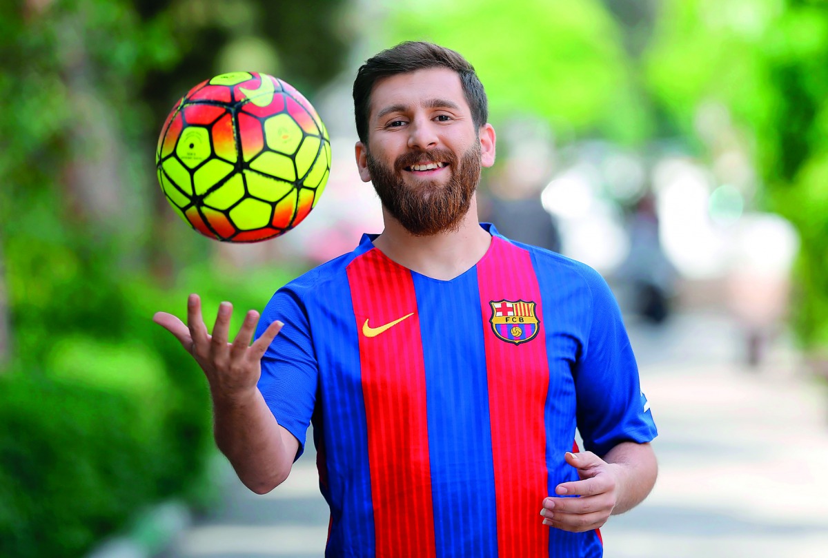 Reza Parastesh, a doppelganger of Lionel Messi, poses for a picture in Tehran. 