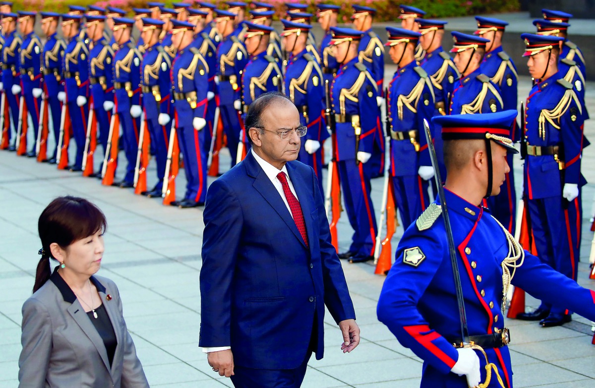 India's Defence Minister Arun Jaitley (centre) reviewing the honour guard with Japan's Defence Minister Tomomi Inada in Tokyo, yesterday.