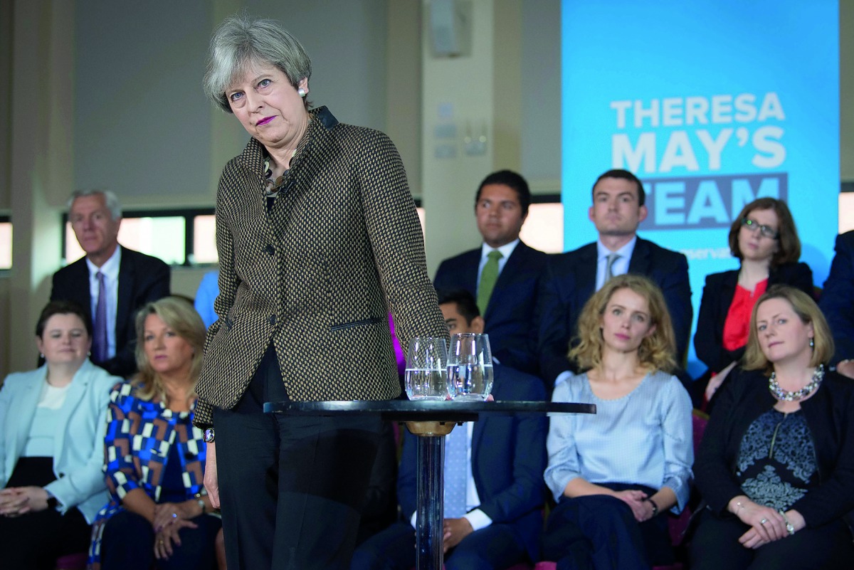 Britain's Prime Minister Theresa May addresses Conservative candidates for London and the southeast at the Dhamecha Lohana Centre in Harrow, northwest London, yesterday.