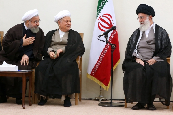 Whether or not Rouhani wins a second term, the bigger prize is controlling who will succeed Supreme Leader Ayatollah Ali Khamenei, whose power far exceeds that of the elected president. The File photo shows supreme leader Ayatollah Ali Khamenei, right, sp