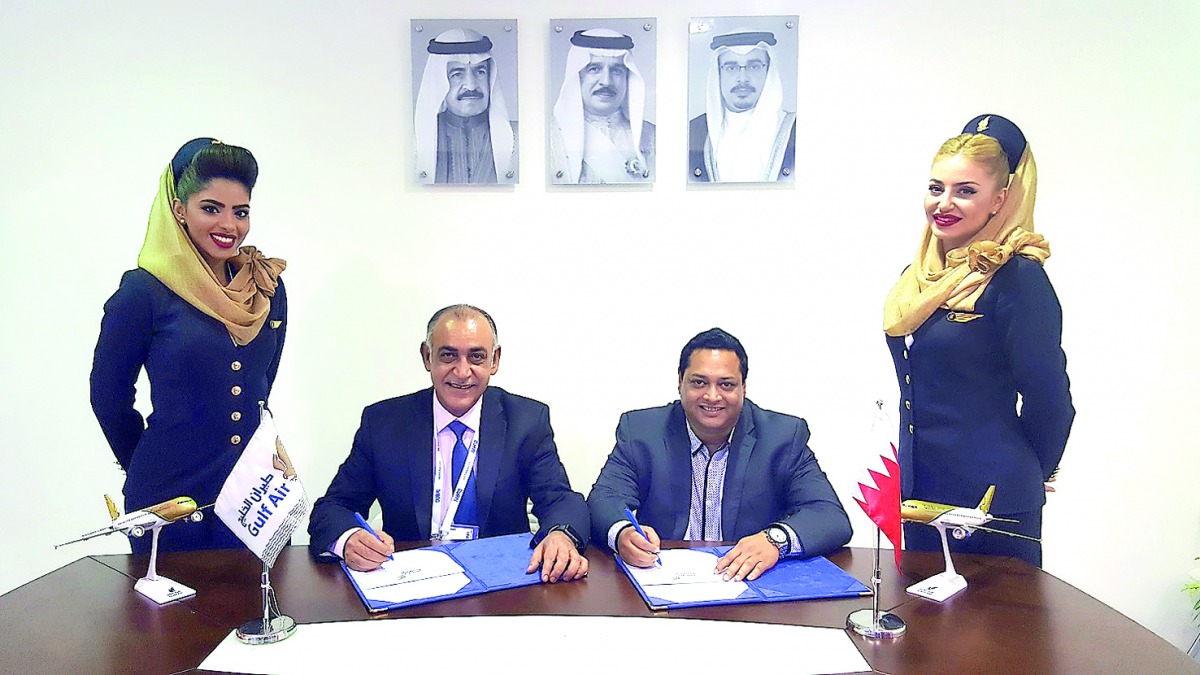 Ahmed Janahi (second left), Gulf Air Chief Commercial Officer,  and Noel Swain (second right), Chief Operating Officer of Ezeego1.com, during the signing ceremony. 