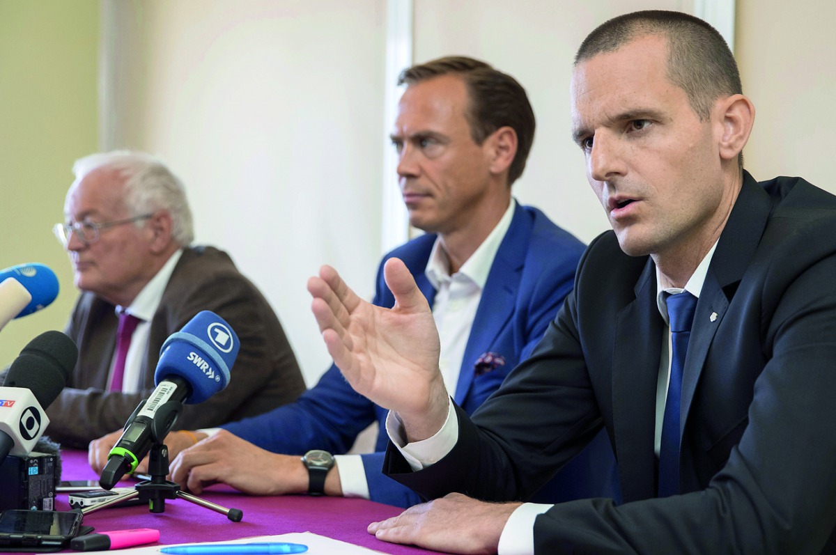 Former Chairmen of the chambers of the independent FIFA Ethics Committee, Hans-Joachim Eckert (left) and Cornel Borbely (right) give a press conference after FIFA's decision to remove its ethics team yesterday. 