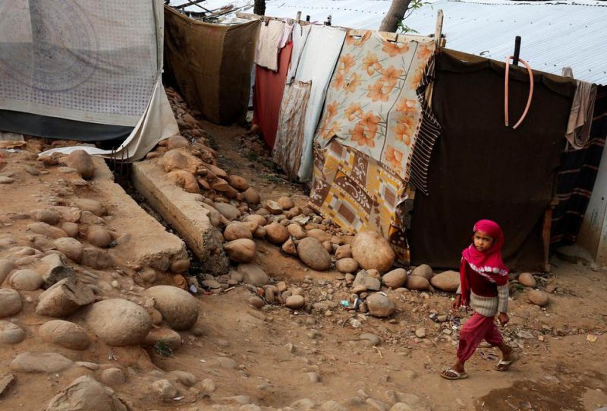 A girl from the Rohingya Muslim community walks past a makeshift settlement on the outskirts of Jammu, May 6, 2017. REUTERS/Mukesh Gupta