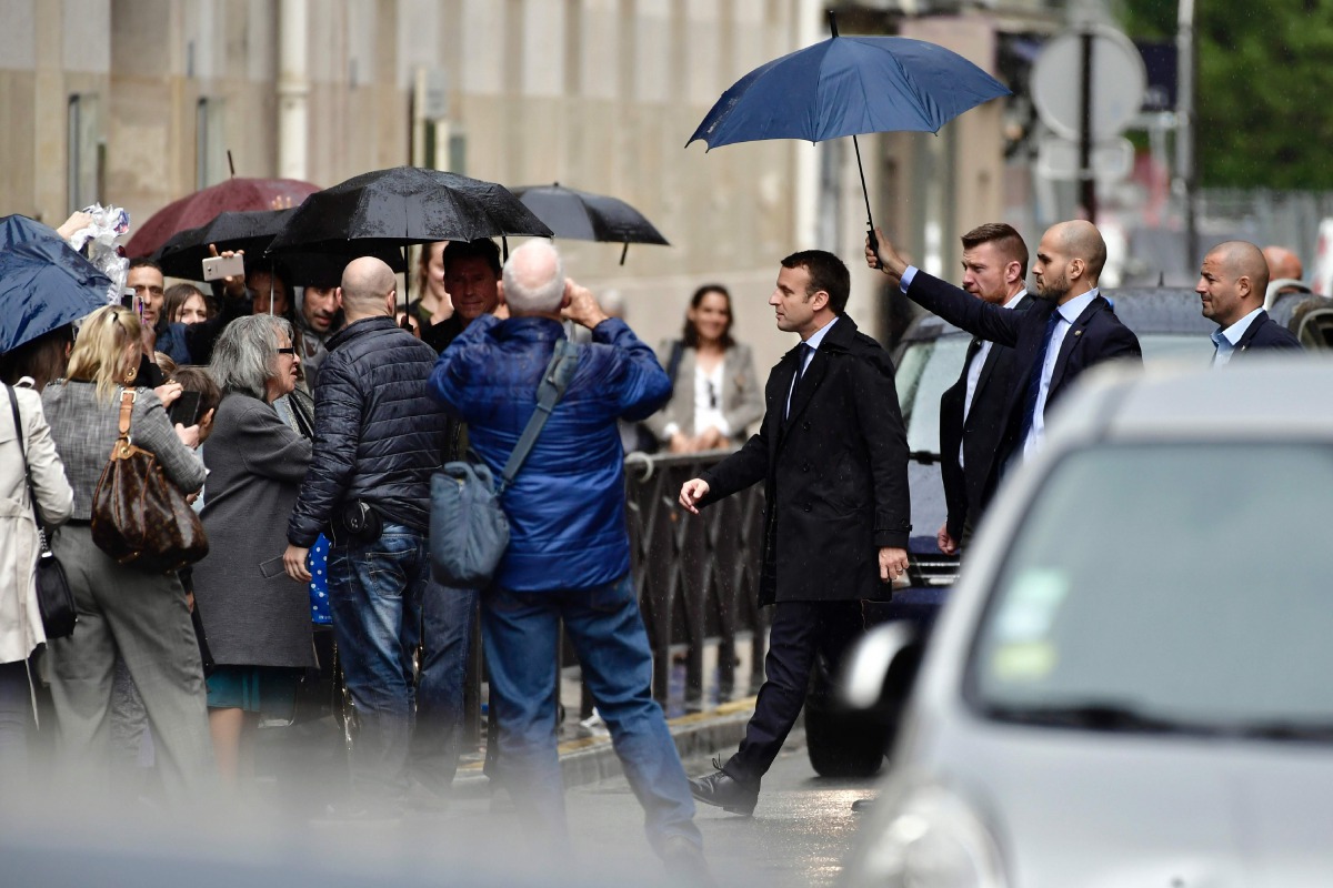 France's president-elect Emmanuel Macron walks in a street, on May 11, 2017 in Paris. AFP / Philippe Lopez