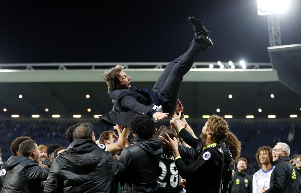 Chelsea manager Antonio Conte is thrown in the air by his players as they celebrate winning the Premier League title Action Images via Reuters / Carl Recine 
