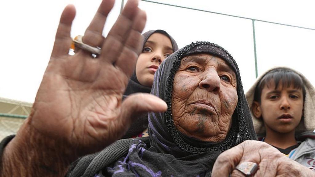 Civilians are seen at a youth center when the clashes between Iraqi soldiers and terrorist organization Daesh continued to retake Iraq's Mosul at Carulla village of Al Makhmour town in Nineveh, Iraq on March 26, 2016. (Hemn Baban - Anadolu Agency ).