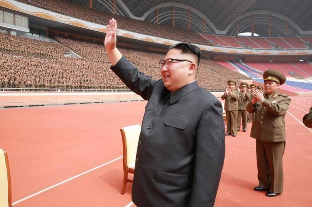 North Korean leader Kim Jong Un waves to the members of the Korean People's Army in this undated photo released by North Korea's Korean Central News Agency (KCNA) May 13, 2017. KCNA/via REUTERS.