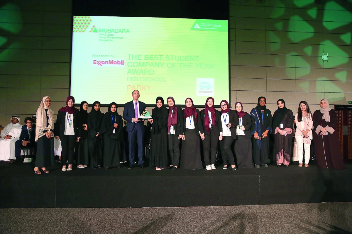 Senior officials of INJAZ Qatar and sponsoring companies posing for a group photo with the winners of the Mubadara 2017 Competition. 