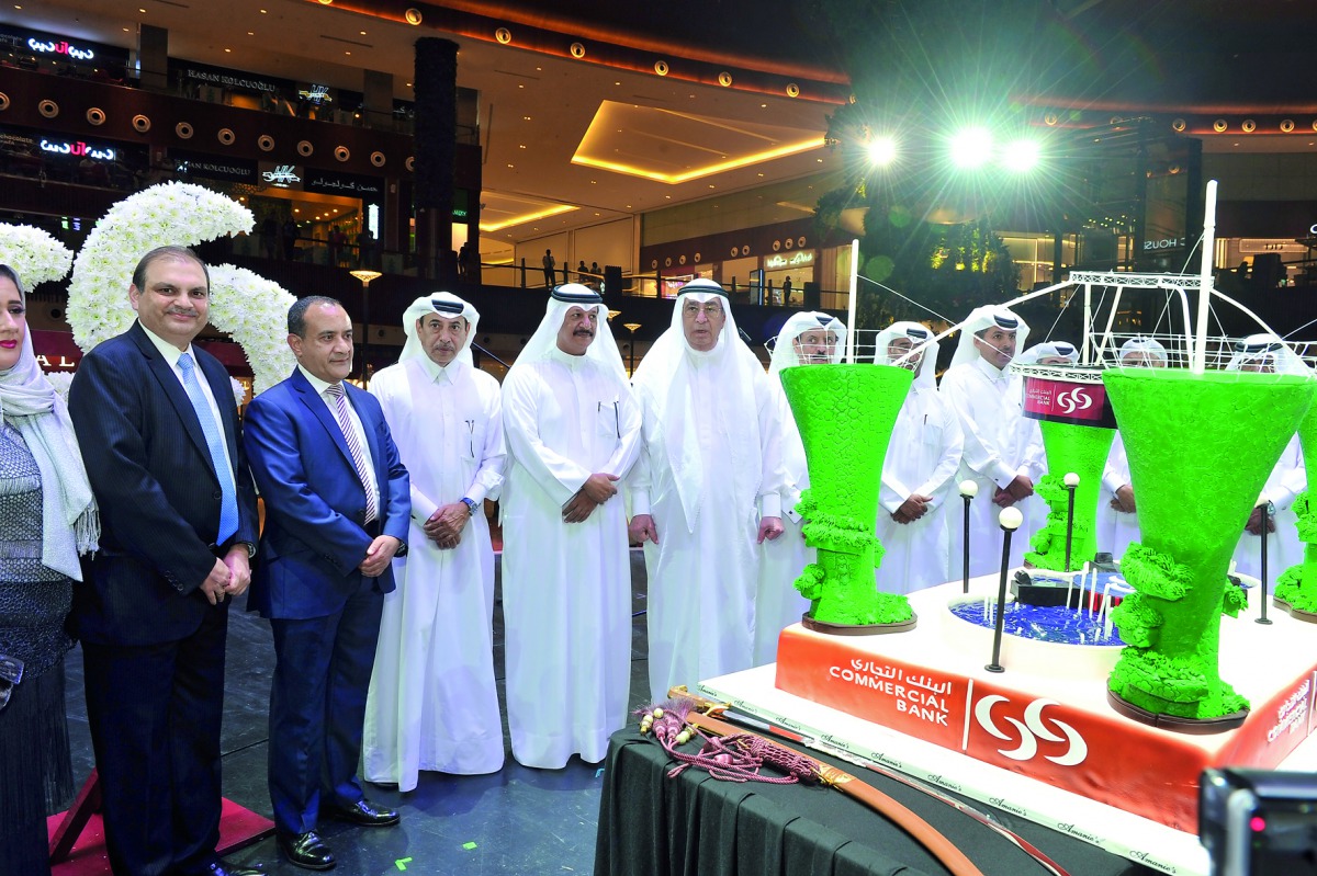 Commercial Bank Chairman, Sheikh Abdullah bin Ali bin Jabor Al Thani (fourth left), Vice- Chairman Hussain Ibrahim Al Fardan (fifth left), and other officials at the opening ceremony of Commercial Bank's new branch at the Mall of Qatar, yesterday. Pic: Ka