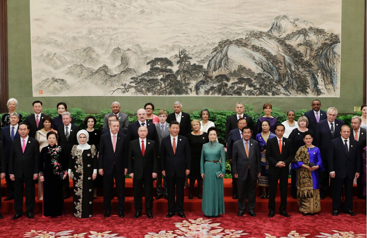 Chinese President Xi Jinping poses for a group photo with other delegates and guests at the welcoming banquet for the Belt and Road Forum in Beijing on May 14, 2017. China touted on Sunday its new Silk Road as 