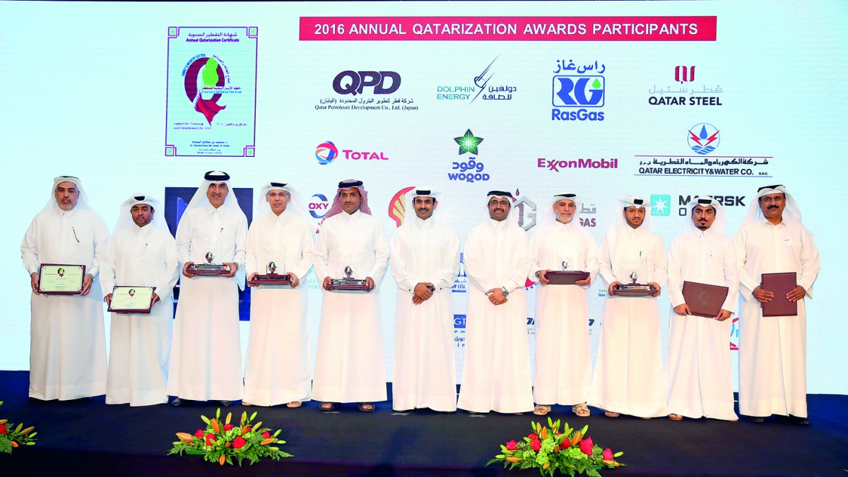 Minister of Energy and Industry, H E Dr Mohammed bin Saleh Al Sada (fifth right); and Saad Sherida Al Kaabi (sixth right), the President & CEO of QP, with the recipients of the awards at  the Qatar’s energy and industry sector’s ‘17th Annual Qatarisation 