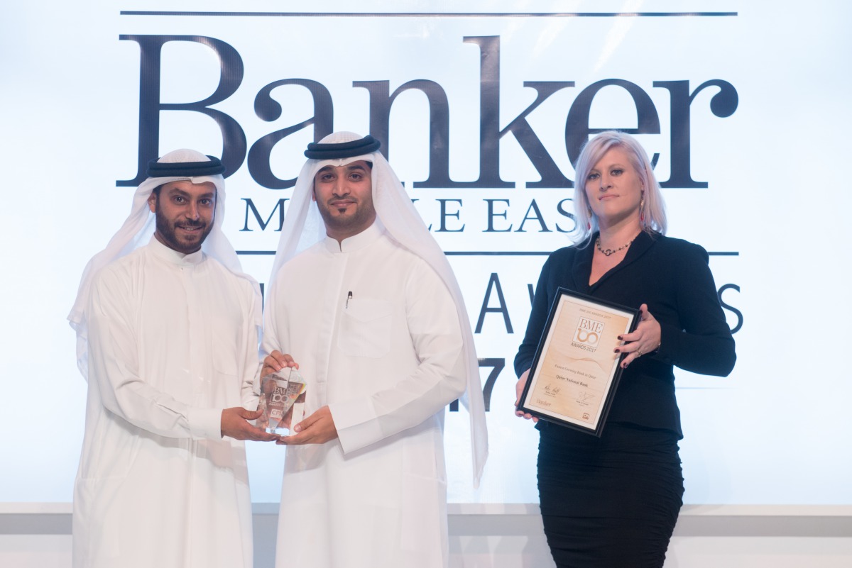 A senior QNB official receiving the recognitions at the 'Banker Magazine' award ceremony.