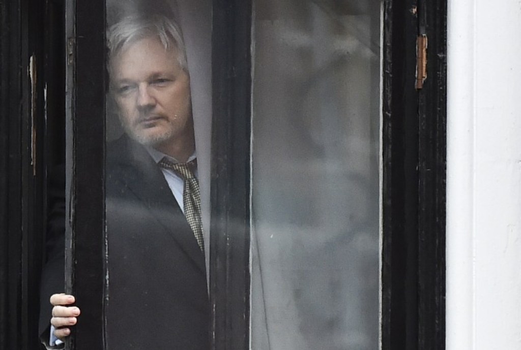 ASSANGE. This file photo taken on February 05, 2016 shows WikiLeaks founder Julian Assange coming out on the balcony of the Ecuadorian embassy to address the media in central London. File photo by Ben Stansall/ AFP.