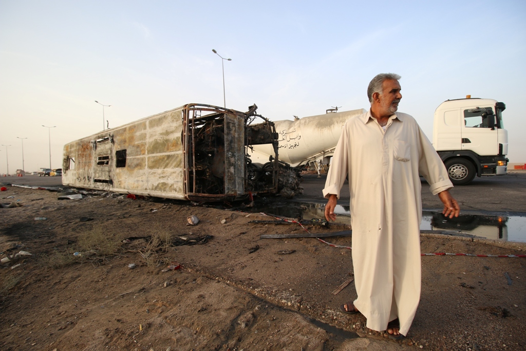 A damaged car is seen after an attack staged twin bombs rocked in Basra, Iraq on May 20, 2017. Haider el-Esadi - AA