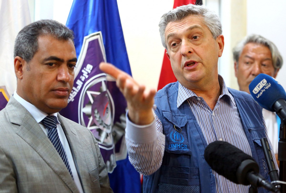 The United Nations' High Commissioner for Refugees (UNHCR) Filippo Grandi (R) speaks during a press conference at the Tripoli branch of the Illegal Immigration Authority, next to its director Colonel Mohammed Beshr, in the Libyan capital on May 21, 2017. 