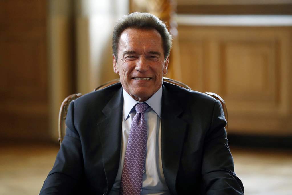 (FILES) This file photo taken on April 28, 2017 shows US former California state senator and president of the Regions of Climate Action (R20) non-profit organisation, Arnold Schwarzenegger meeting with the Mayor of Paris in Paris to sign a convention for 