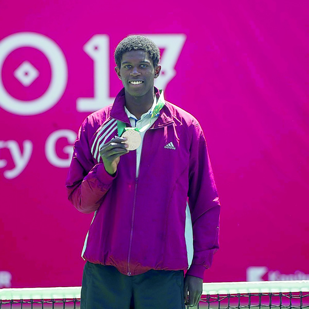 Mubarak Shannan of Qatar, shows off his bronze he won in tennis at the Islamic Solidarity Games in Baku yesterday. Qatar finished with 12 medals at the 11-day event.