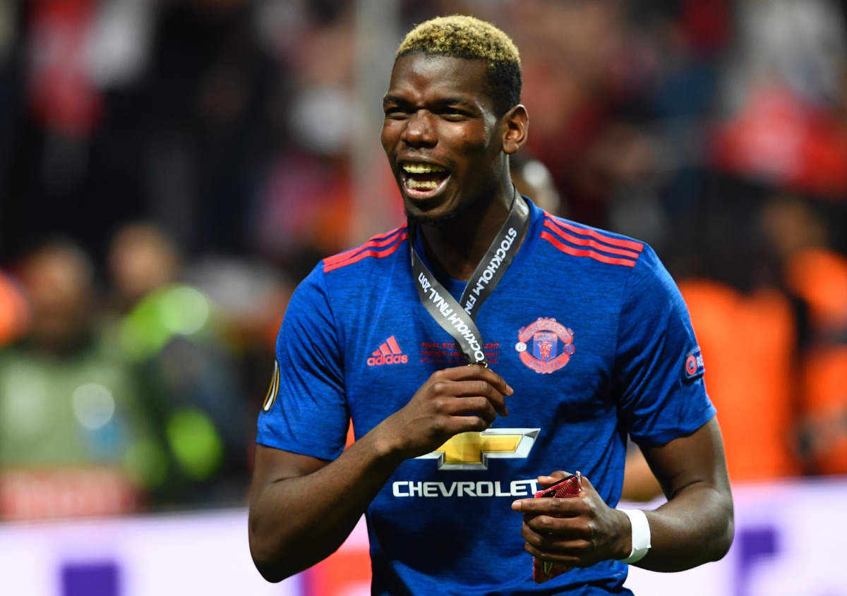 Manchester United's French midfielder Paul Pogba celebrates with his medal after the UEFA Europa League final football match Ajax Amsterdam v Manchester United on May 24, 2017 at the Friends Arena in Solna outside Stockholm. AFP / Jonathan NACKSTRAND