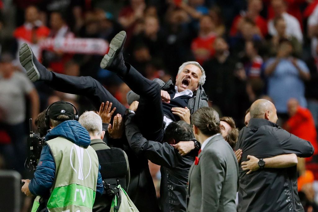 Manchester United's Portuguese manager Jose Mourinho is thrown in the air by his staff after the UEFA Europa League final football match Ajax Amsterdam v Manchester United on May 24, 2017 at the Friends Arena in Solna outside Stockholm. / AFP / Odd ANDERS