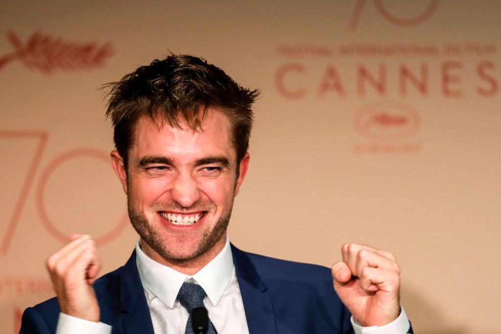 British actor Robert Pattinson talks on May 25, 2017 during a press conference for the film 'Good Time' at the 70th edition of the Cannes Film Festival in Cannes, southern France. / AFP / Laurent EMMANUEL
