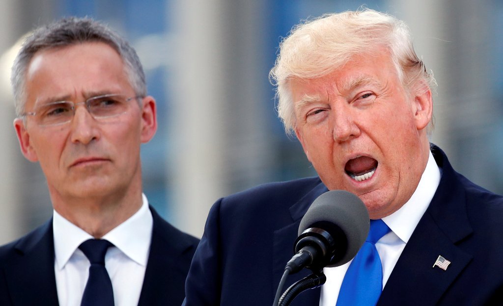 U.S. President Donald Trump (R) speaks beside NATO Secretary General Jens Stoltenberg at the start of the NATO summit at their new headquarters in Brussels, Belgium, May 25, 2017. REUTERS/Christian Hartmann
