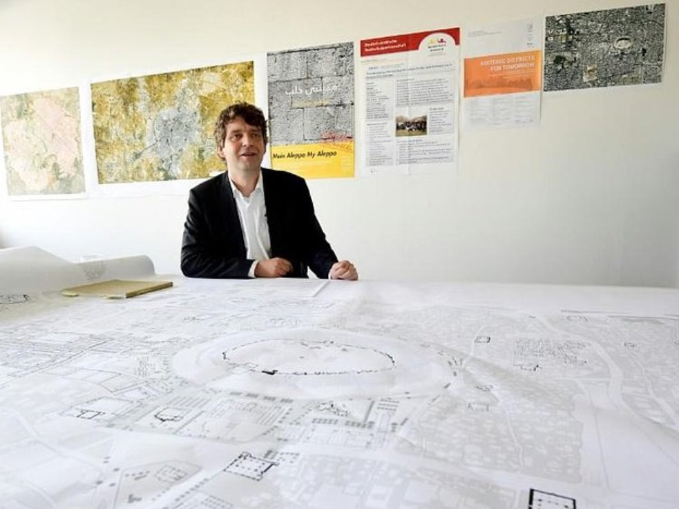 Urban planner Christoph Wessling talks about reconstruction of the devastated Syrian city of Aleppo, at the Brandenburg University of Technology in Cottbus, Germany. AFP
