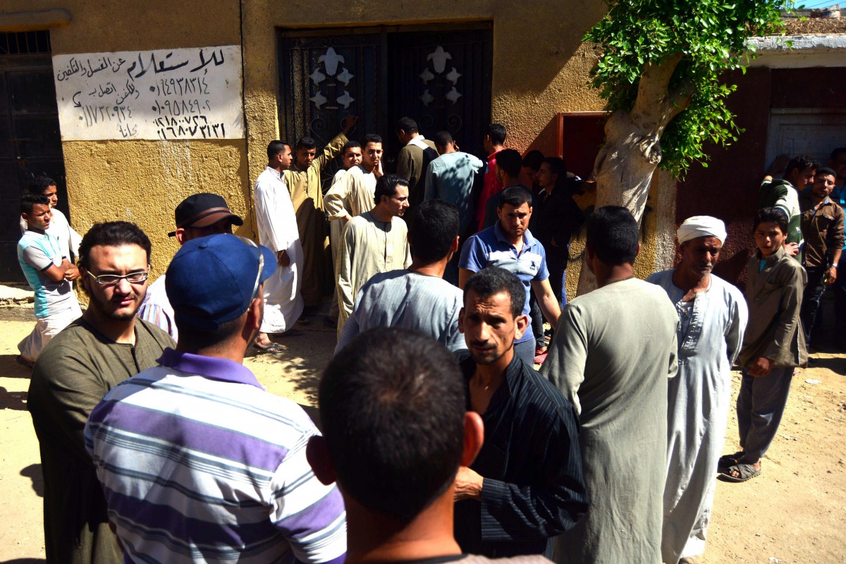 Egyptians wait outside a hospital to retreive some of the bodies of the victims of an attack, in which 28 Coptic pilgirms were gunned down following a visit to a monastery, in Idwah district of the Minya province, some 260 kms south of the capital Cairo, 