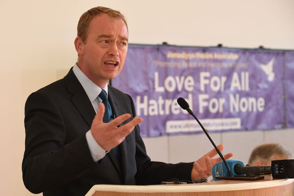 Liberal Democrats leader Tim Farron delivers a speech at a remembrance event held by the Ahmadiyya community for the victims of the Manchester Arena terror attack of May 22, in the Darul Aman Mosque, Manchester, northern England on May 26, 2017. AFP / Oli