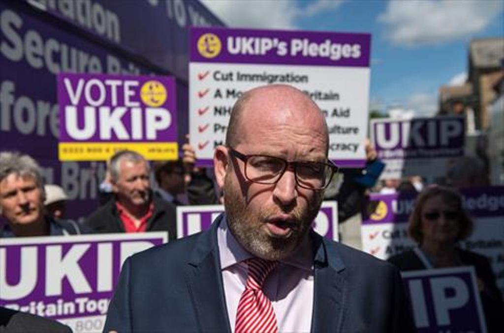 This file photo taken on May 20, 2017 shows UK Independence Party (UKIP) leader Paul Nuttall speaking to supporters as he campaigns with the party's candidate for the Clacton constituency, Peter Oakley (unseen), in Clacton-on-Sea, eastern England, on May 