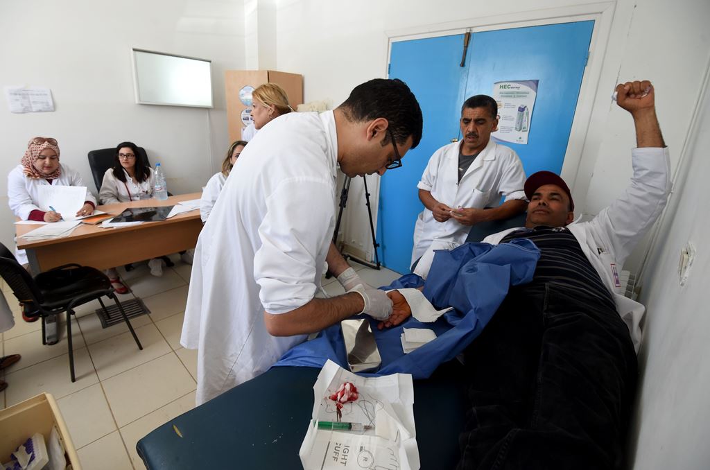 A Tunisian patient receives treatment at the emergency room of the Charles Nicole Hospital in Tunis on May 5, 2017. AFP / FETHI BELAID