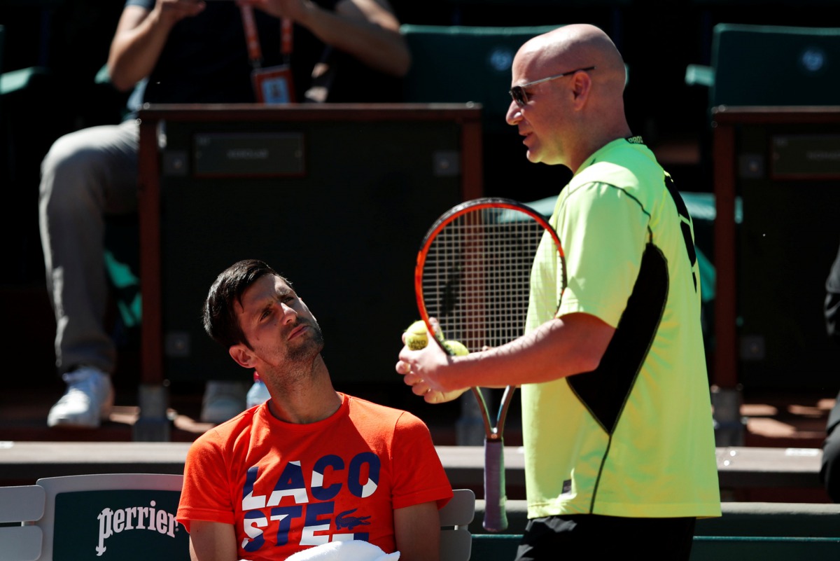 Novak Djokovic of Serbia and his coach Andre Agassi attend a training session. (REUTERS/Benoit Tessier)