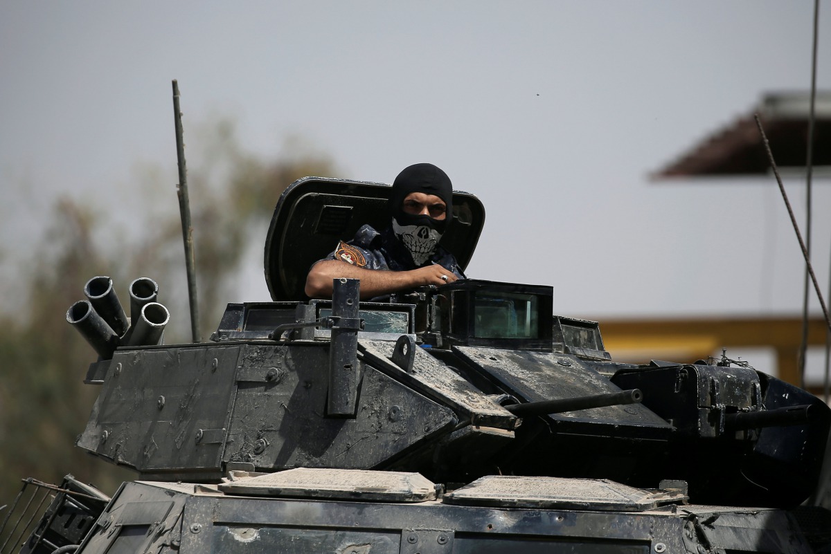 A member of the Iraqi Federal Police is seen on an armoured vehicle at the frontline in western Mosul, Iraq May 29, 2017. REUTERS/Alkis Konstantinidis
