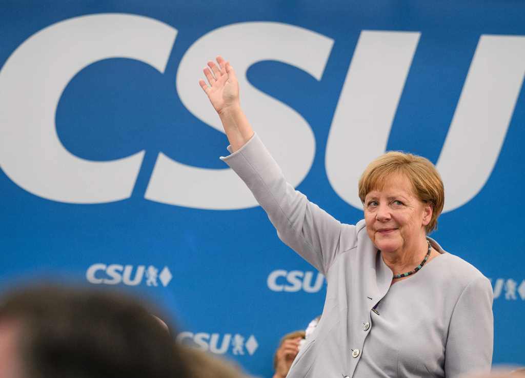 German Chancellor Angela Merkel waves after delivering a speech during a joint campaigning event of the Christian Democratic Union (CDU) and the Christion Social Union (CSU) in Munich, southern Germany, on May 27, 2017. - Germany OUT / AFP / dpa / Matthia