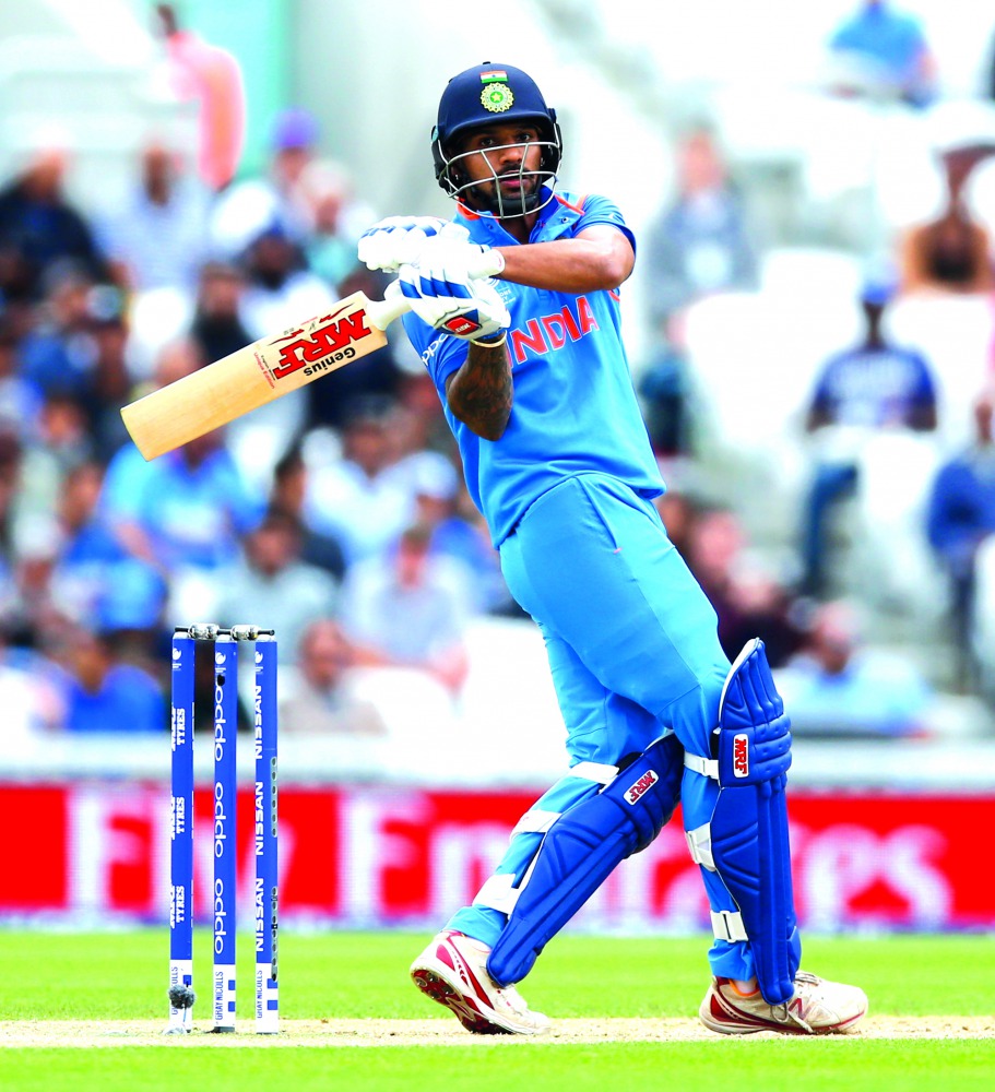 India's Shikhar Dhawan plays a pull during the ICC Champions Trophy warm-up match against Bangladesh, played a The Oval in London yesterday.  
