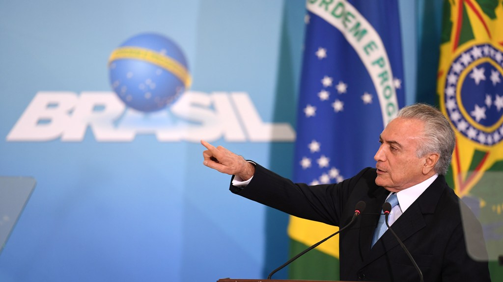 Brazilian President Michel Temer delivers a speech during the inauguration ceremony of the new Minister of Justice, Torquato Jardim at the Planalto Palace in Brasilia, on May 31, 2017.  AFP / EVARISTO SA
