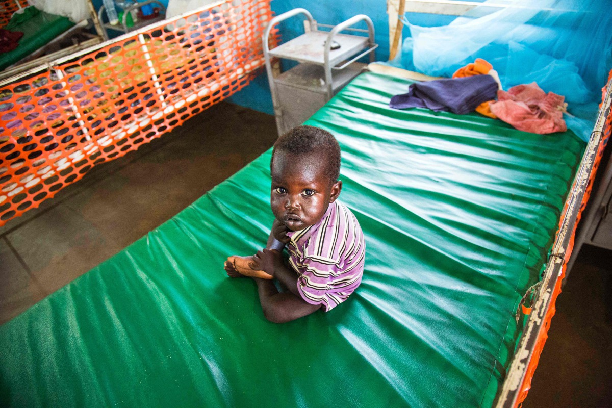 REPRESENTATIVE IMAGE: A malnourished child sits on May 30, 2017, on a bed at the clinic run by Doctors Without Borders (MSF) in Aweil, Northern Bahr al Ghazal, South Sudan. AFP / Albert Gonzalez Farran