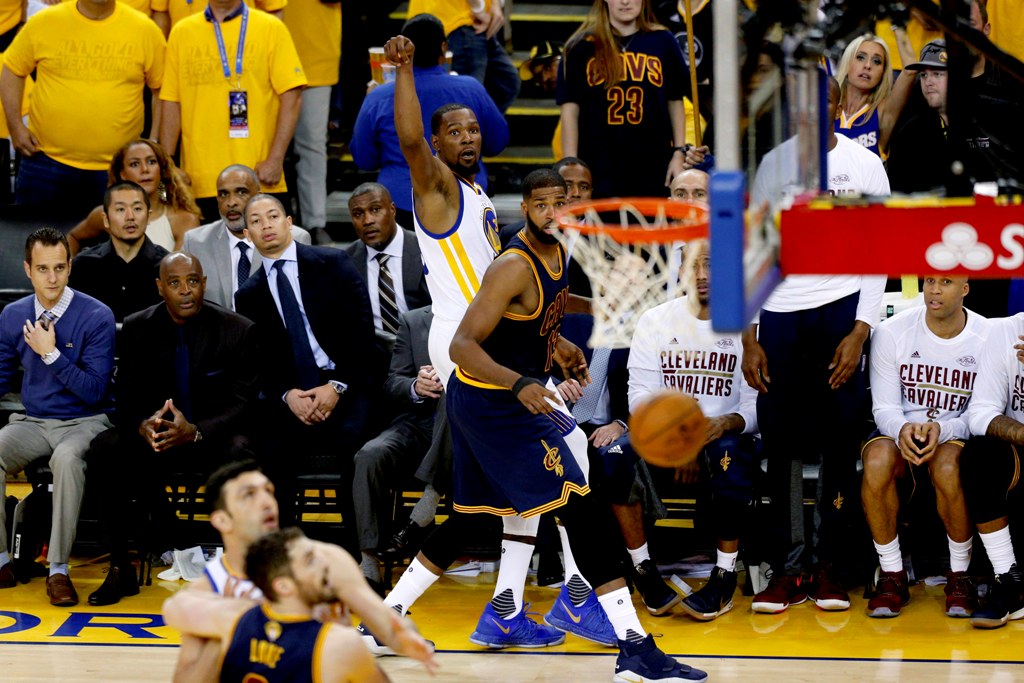 Golden State Warriors forward Kevin Durant (35) makes a three point basket over Cleveland Cavaliers forward Tristan Thompson (13) in the third quarter in game one of the Finals for the 2017 NBA Playoffs at Oracle Arena.  Cary Edmondson
