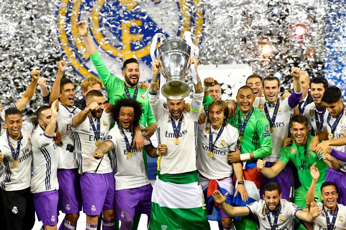 In this handout image provided by UEFA, Sergio Ramos of Real Madrid lifts the trophy after Real Madrid won the UEFA Champions League final football match between Juventus and Real Madrid at The Principality Stadium in Cardiff, south Wales.