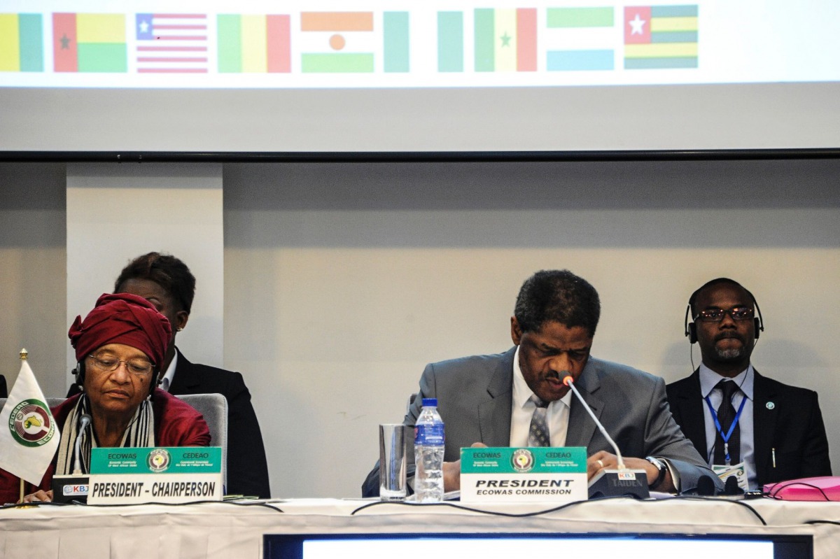 Liberia's President and ECOWAS (Economic Community of West African States) Chairperson Ellen Johnson Sirleaf (L) looks on as ECOWAS president Marcel De Souza (2-R) speaks during the ECOWAS summit on June 4, 2017 in Monrovia. AFP / Zoom Dosso